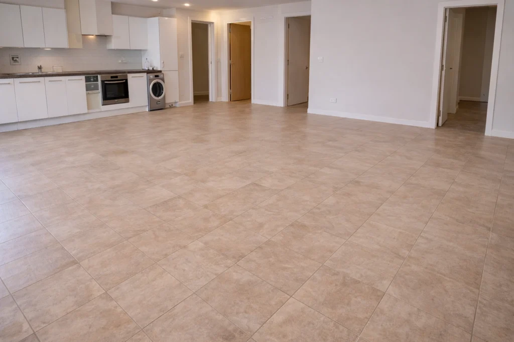 Empty flat with clean tiled floor and kitchen after an end of tenancy clean